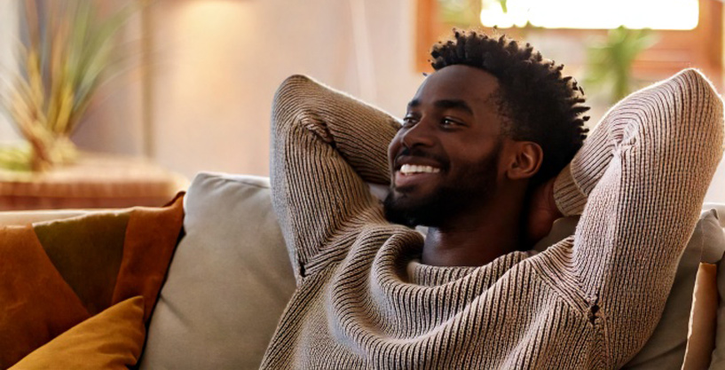 Young man relaxing in a clean home free of dust or allergens